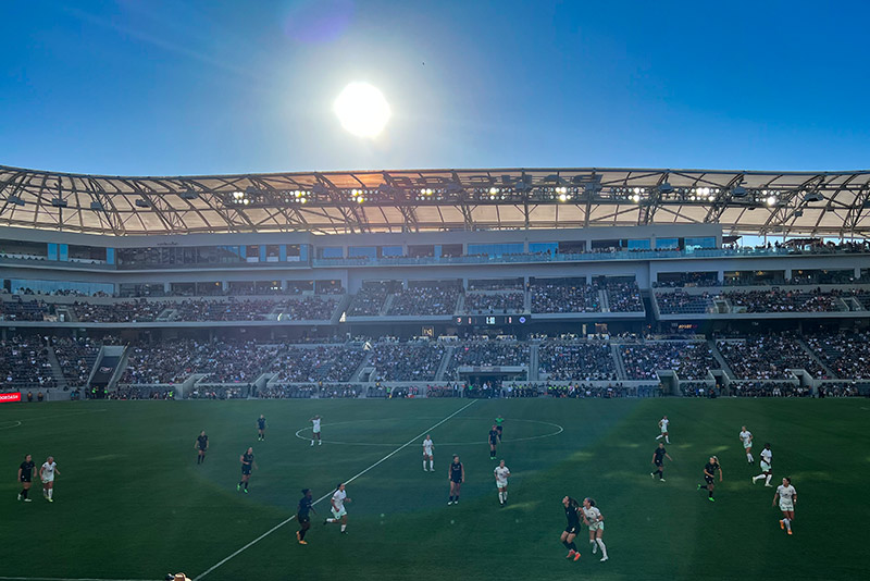 The sun makes a perfect visible circle over the players on the field at Banc of California.